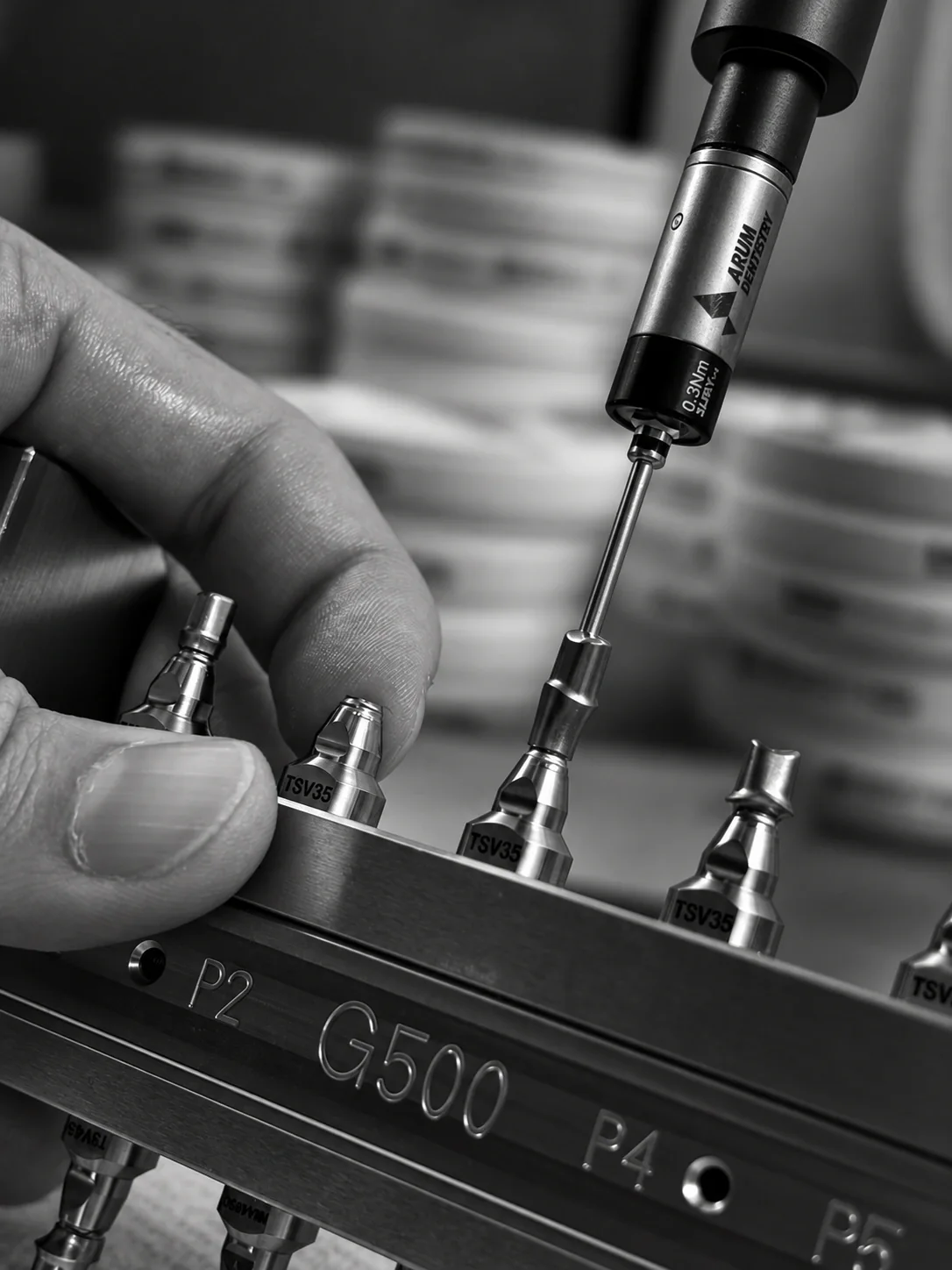 Close-up of precision work on implant components